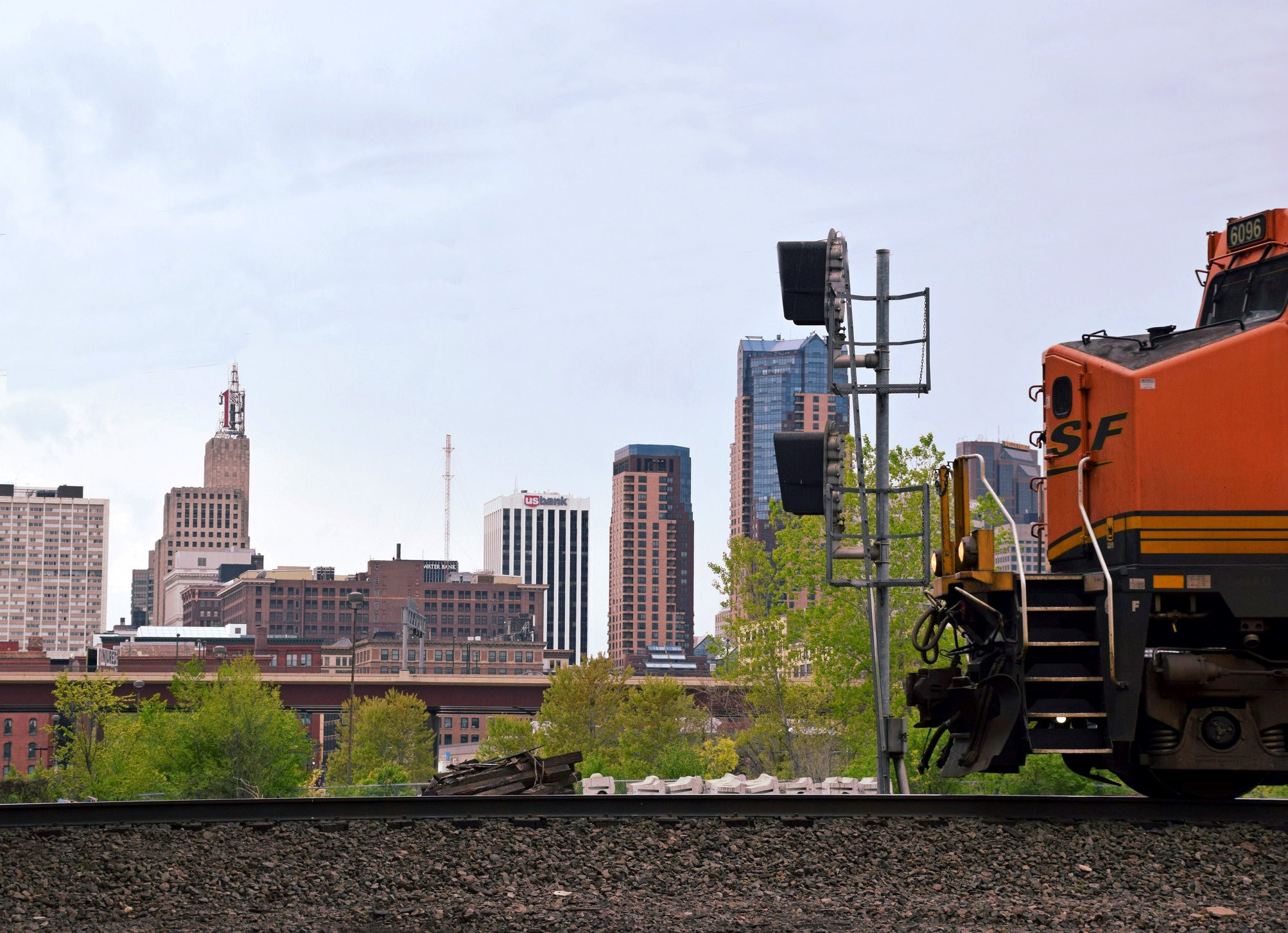 A BNSF locomotive passes the St. Paul skyline