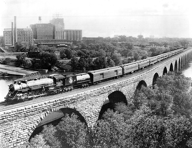 Great Northern’s Empire Builder on the Stone Arch Bridge, part of the ten-mile stretch between Minneapolis and St. Paul