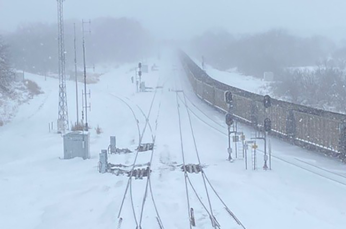 In Lincoln, Nebraska, a coal train seems to stretch into infinity, a result of whiteout conditions.